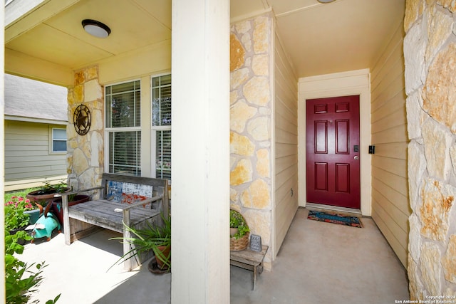 property entrance with covered porch