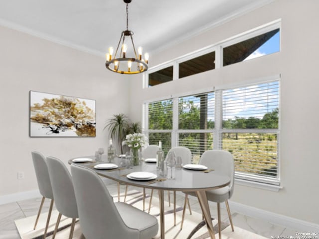 dining room featuring a wealth of natural light, ornamental molding, and an inviting chandelier