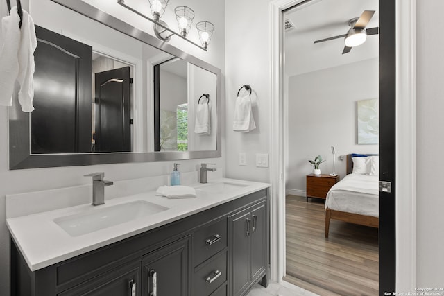 bathroom featuring vanity, ceiling fan, and hardwood / wood-style flooring