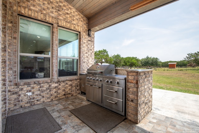 view of patio / terrace featuring exterior kitchen and grilling area