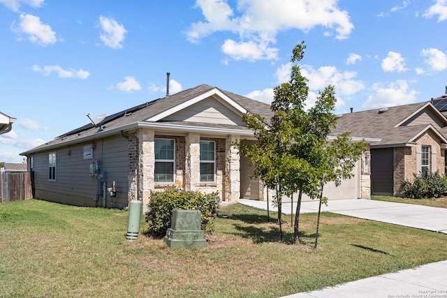 view of front of house with a garage and a front yard