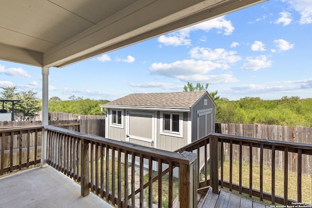 wooden terrace with a storage unit