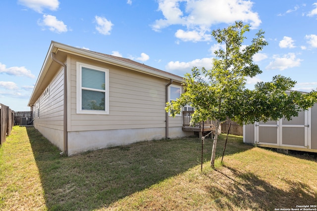 exterior space with a yard and a shed