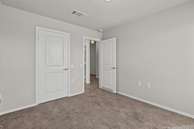 spare room with carpet floors