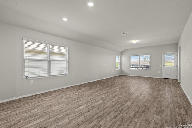 unfurnished room with hardwood / wood-style floors