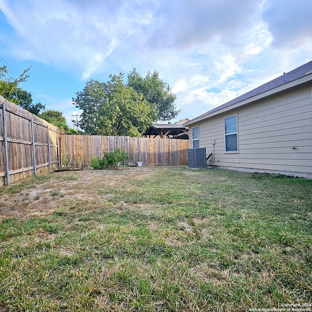 view of yard with central AC unit