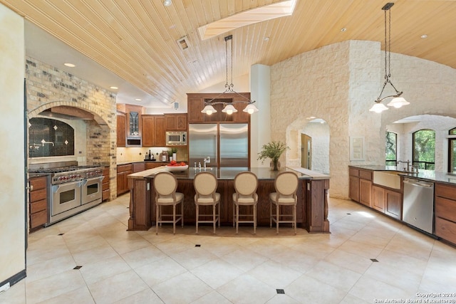 kitchen featuring built in appliances, visible vents, brown cabinetry, arched walkways, and wood ceiling
