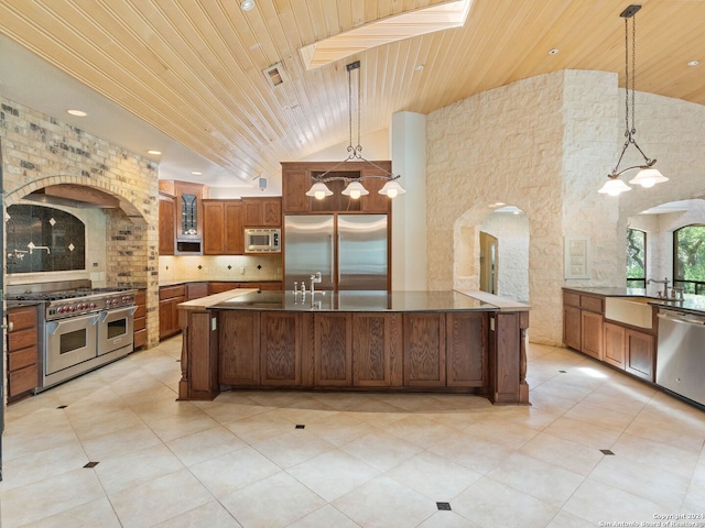 kitchen with arched walkways, visible vents, wooden ceiling, a sink, and built in appliances