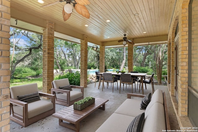 view of patio featuring outdoor dining space, ceiling fan, and an outdoor hangout area