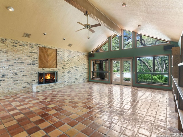 unfurnished living room featuring visible vents, a ceiling fan, a fireplace, beam ceiling, and high vaulted ceiling