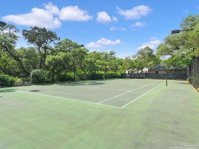 view of sport court featuring community basketball court and fence
