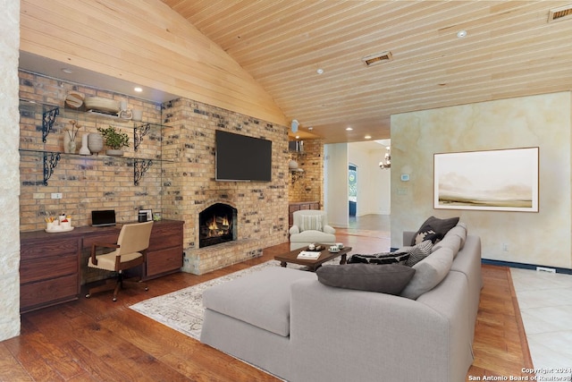 living area featuring wood finished floors, wooden ceiling, vaulted ceiling, and a fireplace
