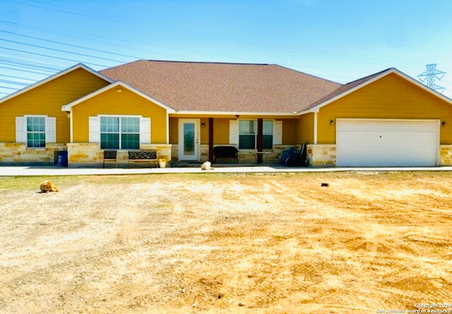 ranch-style home featuring a garage