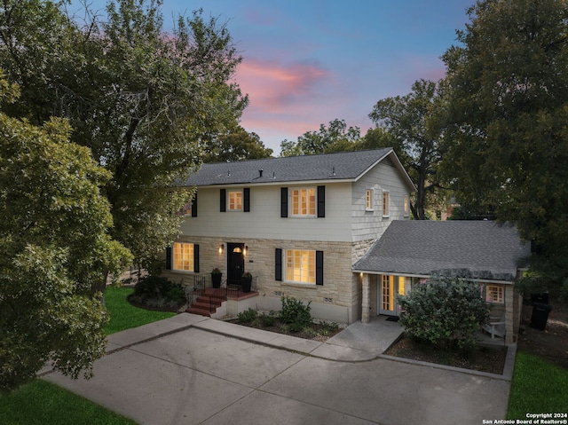 106 Morningside Dr, Terrell Hills, TX 78209 - colonial home with a shingled roof and stone siding