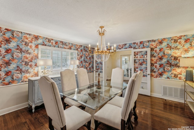 dining room with a textured ceiling, crown molding, and dark hardwood / wood-style floors