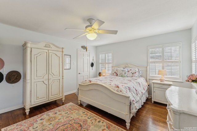 bedroom featuring dark wood-type flooring and ceiling fan