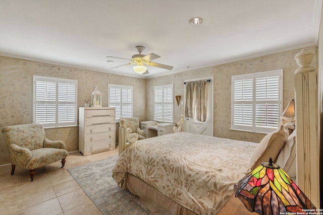 tiled bedroom featuring ceiling fan and ornamental molding