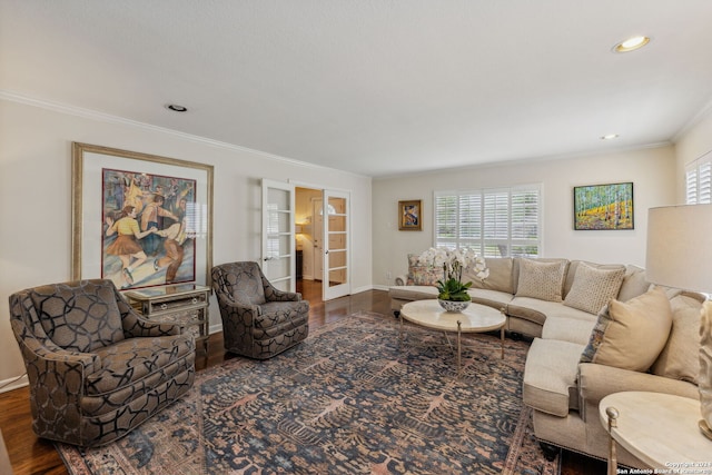 living room featuring ornamental molding and dark hardwood / wood-style flooring