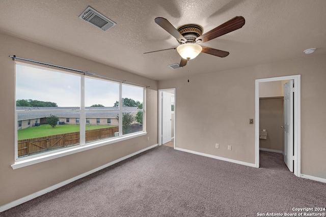 10314 Mustang Rdg, Converse, TX 78109 - carpeted empty room with ceiling fan, baseboards, and a textured ceiling
