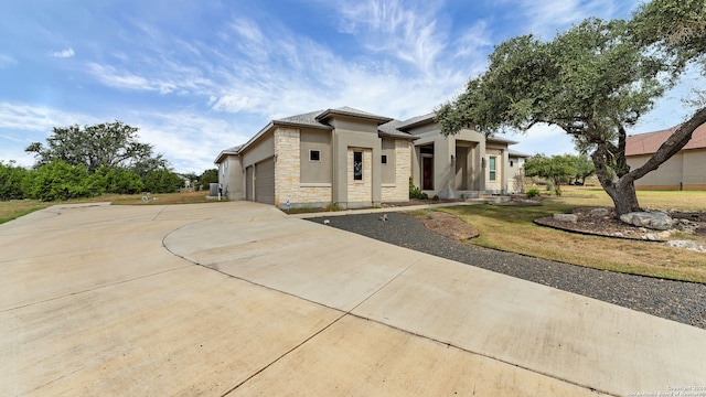 view of front facade with a front yard and a garage