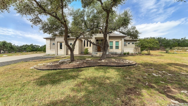 view of front of home with a front lawn