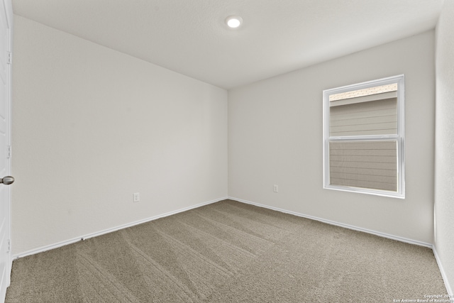 view of carpeted spare room