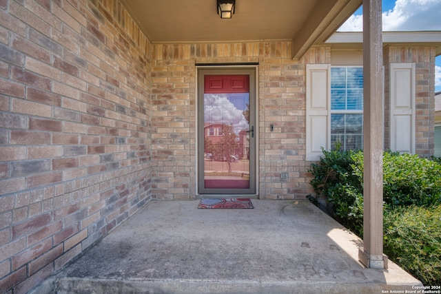 doorway to property with a patio