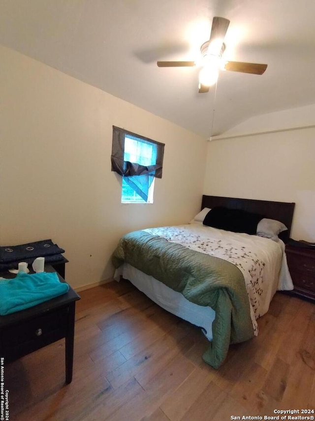 bedroom featuring ceiling fan and hardwood / wood-style floors