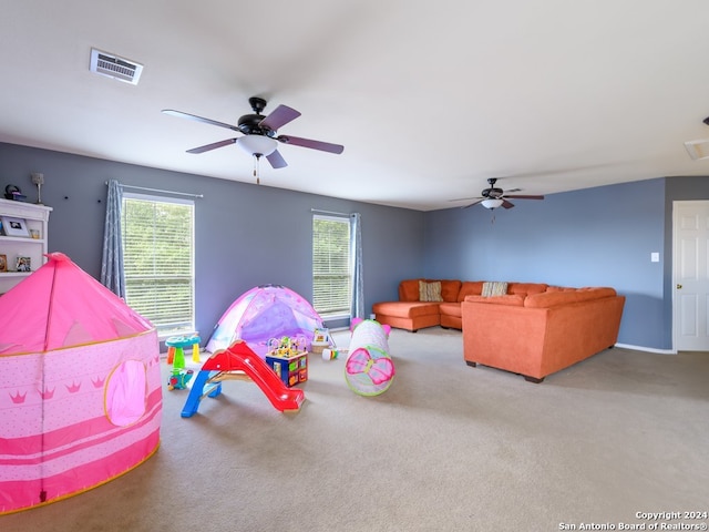 recreation room featuring carpet and ceiling fan