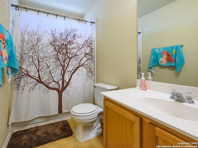 bathroom with tile patterned flooring, vanity, toilet, and a shower with shower curtain