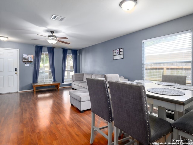 dining space featuring ceiling fan and dark hardwood / wood-style flooring