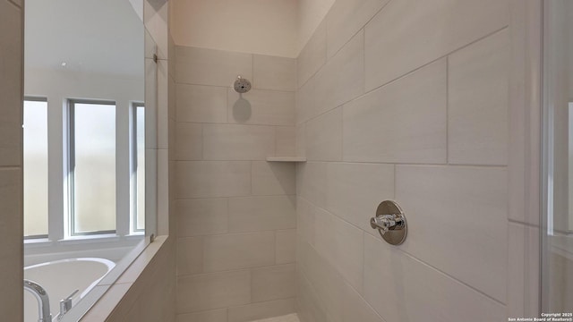 bathroom featuring separate shower and tub