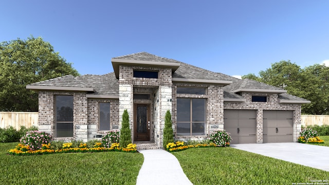 view of front of property with a garage and a front yard