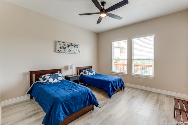 bedroom featuring light wood-type flooring and ceiling fan