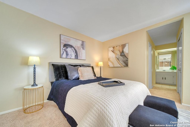 carpeted bedroom featuring connected bathroom