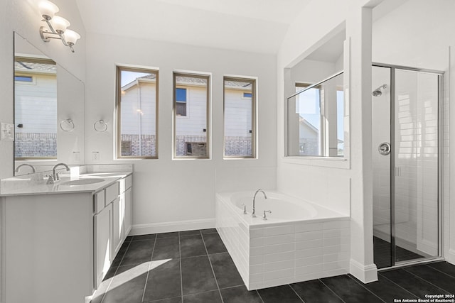 bathroom with tile patterned flooring, vanity, and independent shower and bath