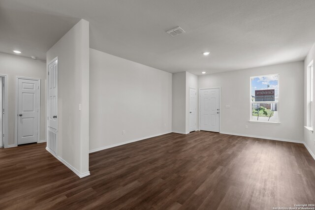 unfurnished room featuring dark hardwood / wood-style flooring