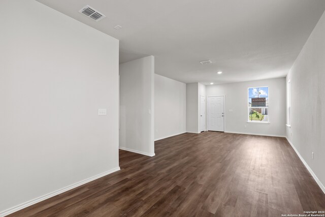 spare room with dark hardwood / wood-style flooring