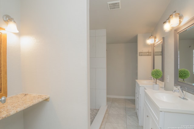 bathroom featuring tile patterned floors and vanity