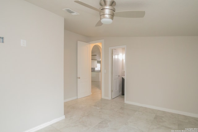 unfurnished room with ceiling fan and vaulted ceiling