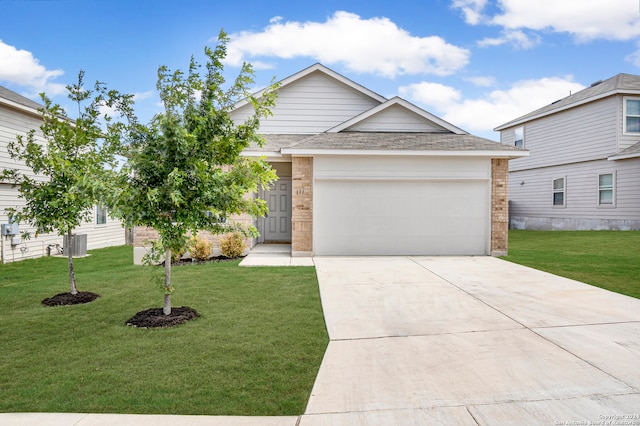 view of front of home featuring a garage and a front lawn