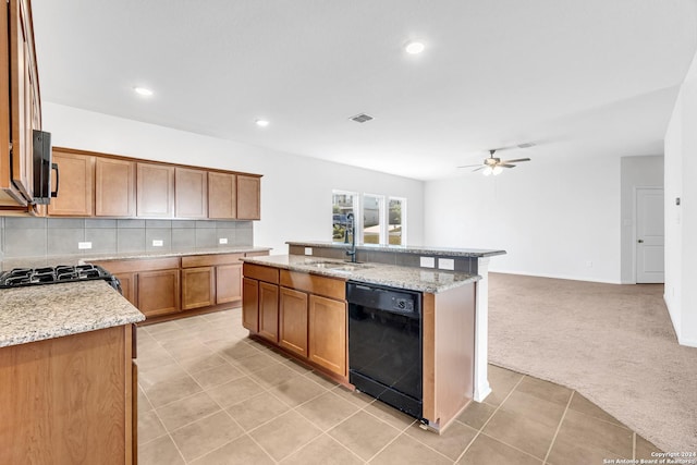 kitchen featuring light colored carpet, visible vents, decorative backsplash, stove, and dishwasher