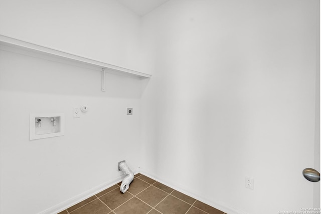 washroom with hookup for a washing machine, hookup for a gas dryer, hookup for an electric dryer, laundry area, and dark tile patterned floors