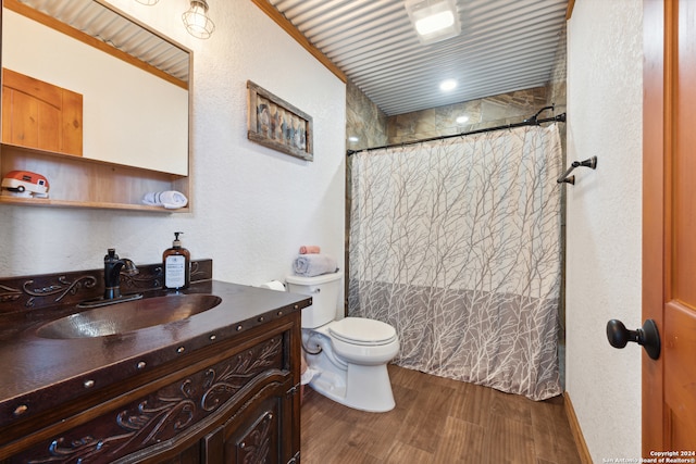 bathroom featuring vanity, a shower with shower curtain, toilet, ornamental molding, and hardwood / wood-style flooring