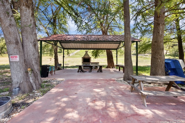 view of property's community with a yard and a gazebo