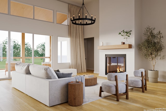 living room with wood-type flooring, a multi sided fireplace, a notable chandelier, and a towering ceiling