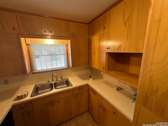 kitchen featuring light tile patterned floors and sink