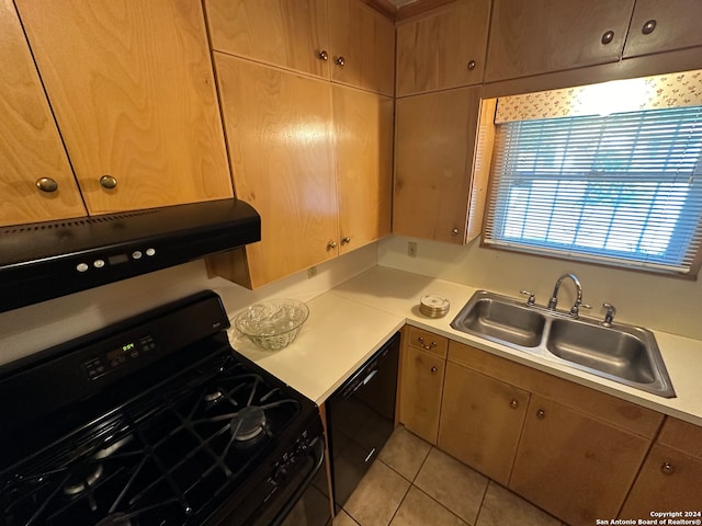 kitchen featuring black appliances, light tile patterned flooring, sink, and extractor fan