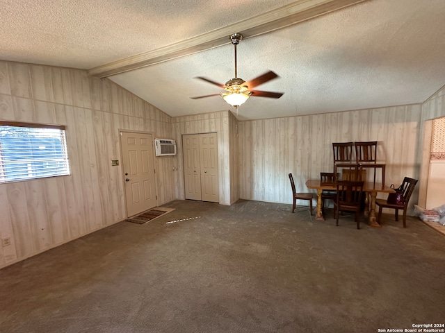 carpeted dining space with a textured ceiling, ceiling fan, a wall unit AC, and lofted ceiling