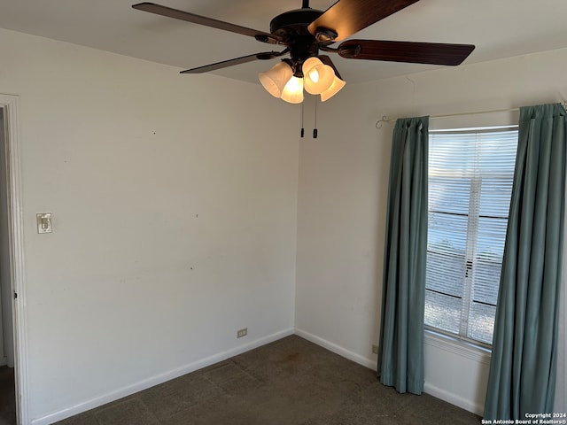 carpeted empty room with ceiling fan